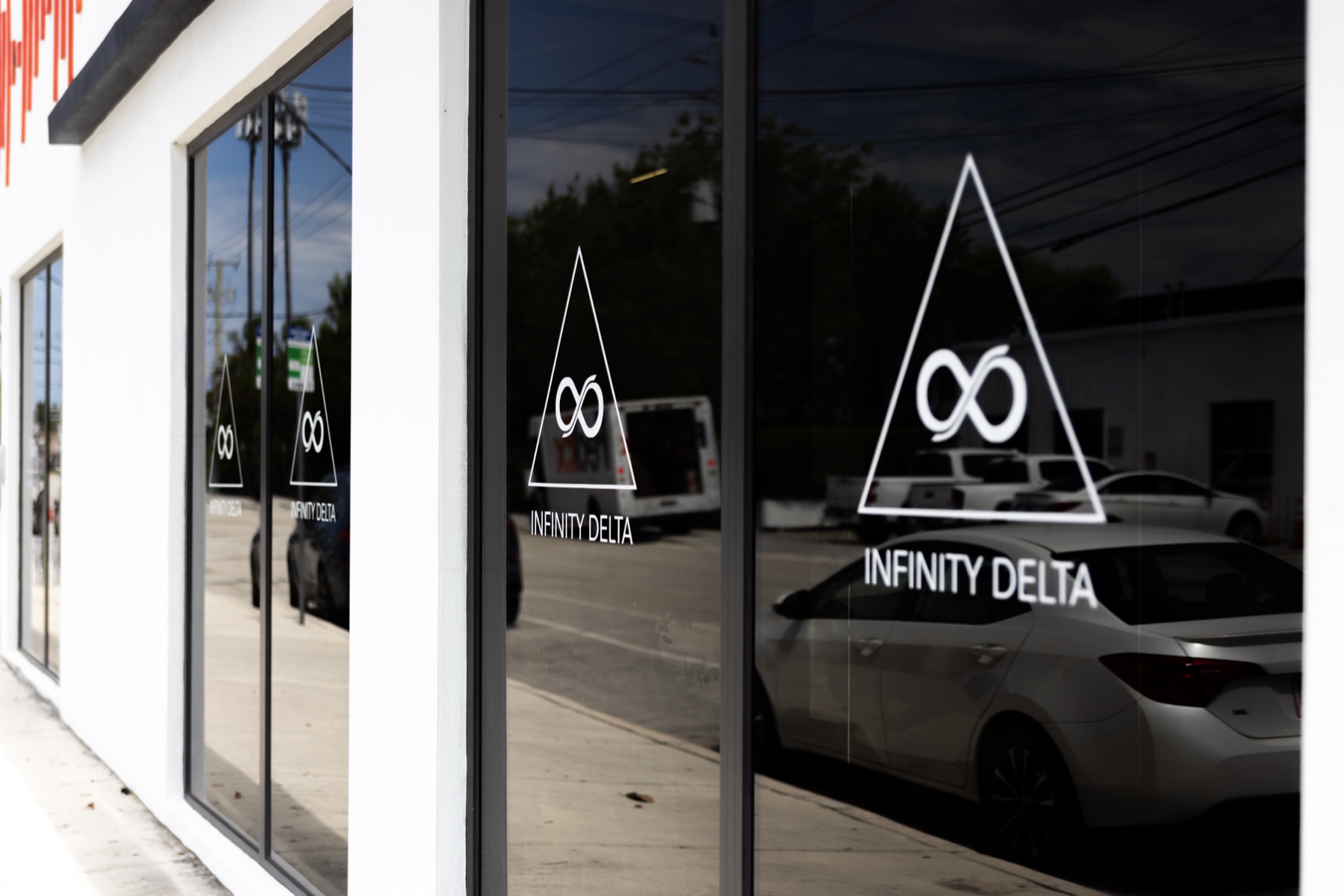 Infinity Delta branding on the windows of its Miami facility
