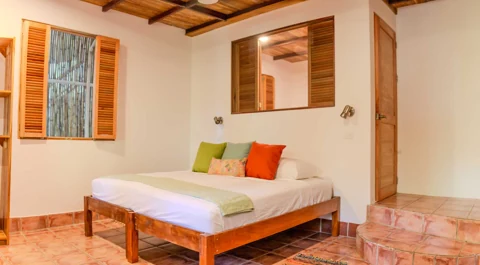 Encanta La Vida · Mariposa king bedroom.